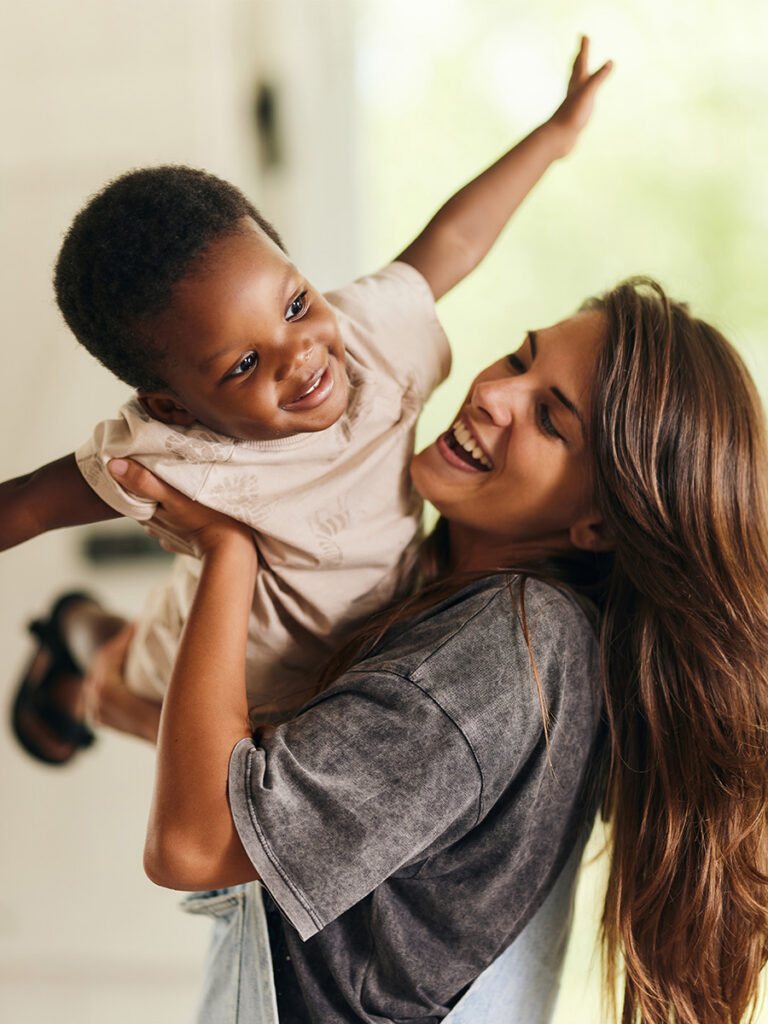 Mom and Son playing airplane
